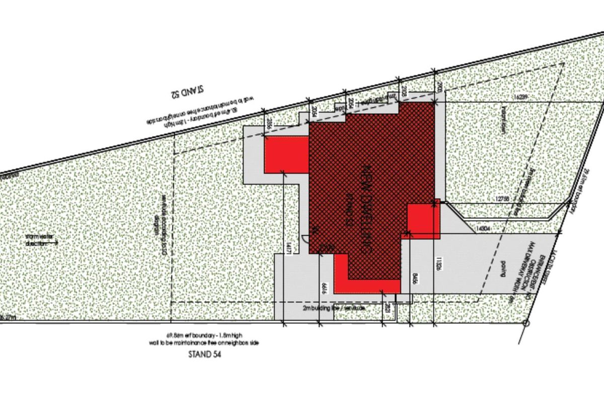 A detailed site plan showing the proposed new dwelling footprint, boundary lines, and driveway layout on the property.