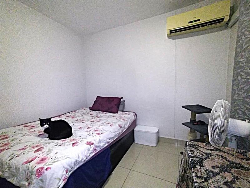 A bedroom featuring tiled flooring and a wall-mounted split-system air conditioning unit.