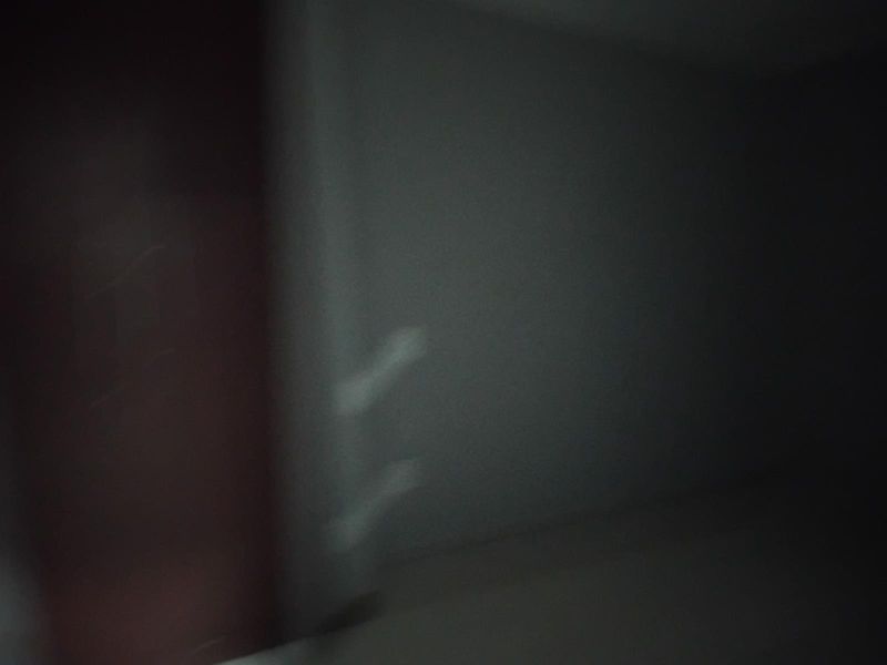A dark, blurry, and low-quality image of an interior space that does not provide enough detail to identify the room type or features.