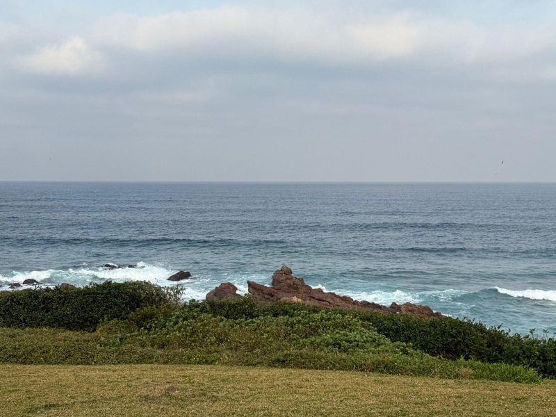 A scenic view of the ocean and rocky coastline, showcasing the natural beauty and proximity to the sea.