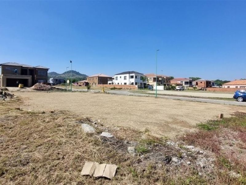 A vacant residential plot of land situated in a developed neighborhood, offering a clear space ready for new construction.