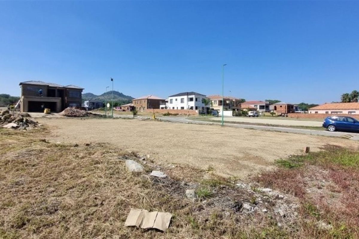 A vacant residential plot of land situated in a developed neighborhood, offering a clear space ready for new construction.