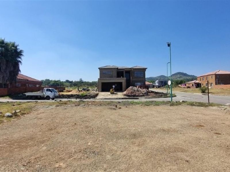 A vacant residential plot of land situated in a developed neighborhood, offering a clear site for new construction.