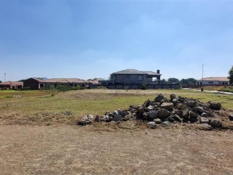 A vacant residential plot of land situated in a developed neighborhood, offering a clear space ready for new construction.