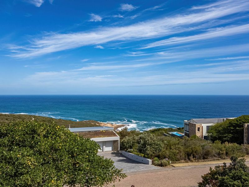 Stunning elevated coastal view overlooking the ocean and surrounding natural landscape.