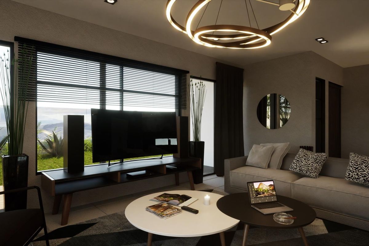 A modern, well-lit living room featuring large windows with garden views, recessed ceiling lighting, and a contemporary circular chandelier.