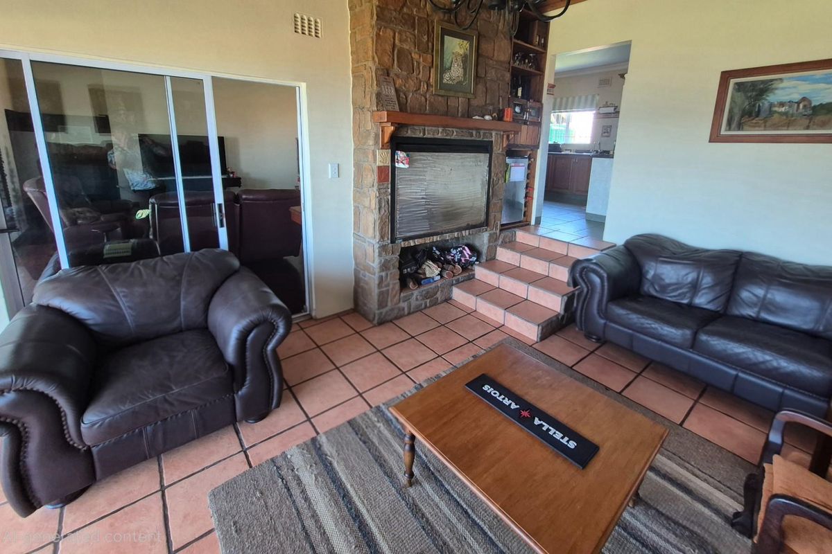 Living room featuring a stone-clad fireplace, tiled flooring, and sliding glass doors leading to an adjacent space.