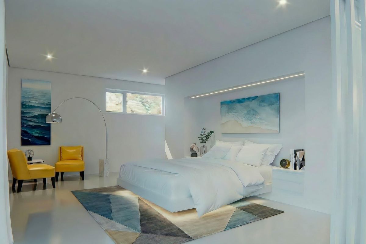 A modern, minimalist bedroom featuring recessed ceiling lighting, integrated wall lighting, and clean, polished flooring.