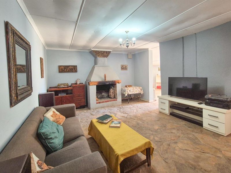 Versatile 4-Bedroom Home with Income-Generating Workshop in Uniondale - Photo 6