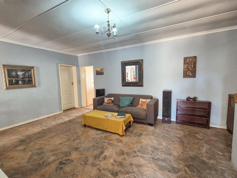 Versatile 4-Bedroom Home with Income-Generating Workshop in Uniondale - Photo 5