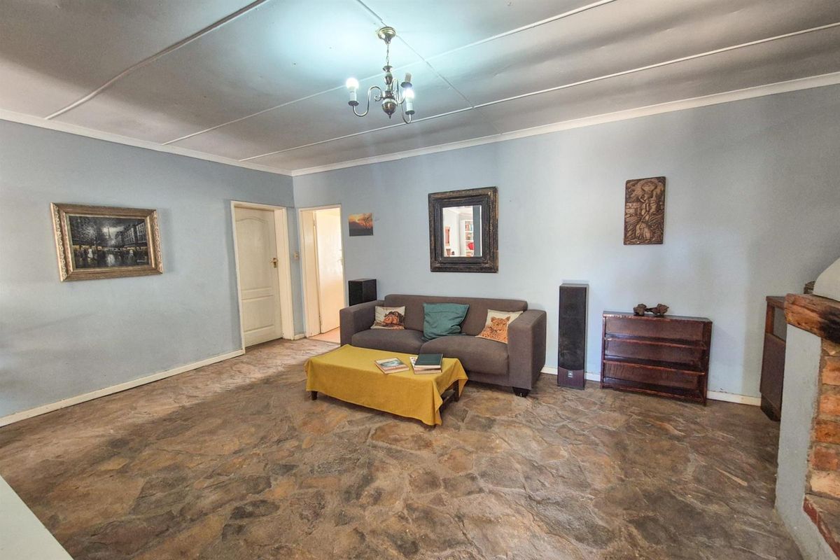 Versatile 4-Bedroom Home with Income-Generating Workshop in Uniondale - Photo 5