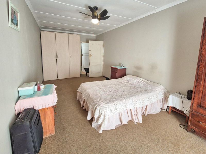 Versatile 4-Bedroom Home with Income-Generating Workshop in Uniondale - Photo 7