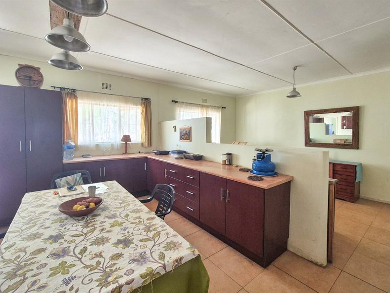 Versatile 4-Bedroom Home with Income-Generating Workshop in Uniondale - Photo 10