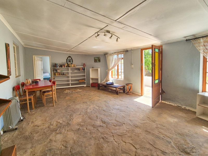 Versatile 4-Bedroom Home with Income-Generating Workshop in Uniondale - Photo 4