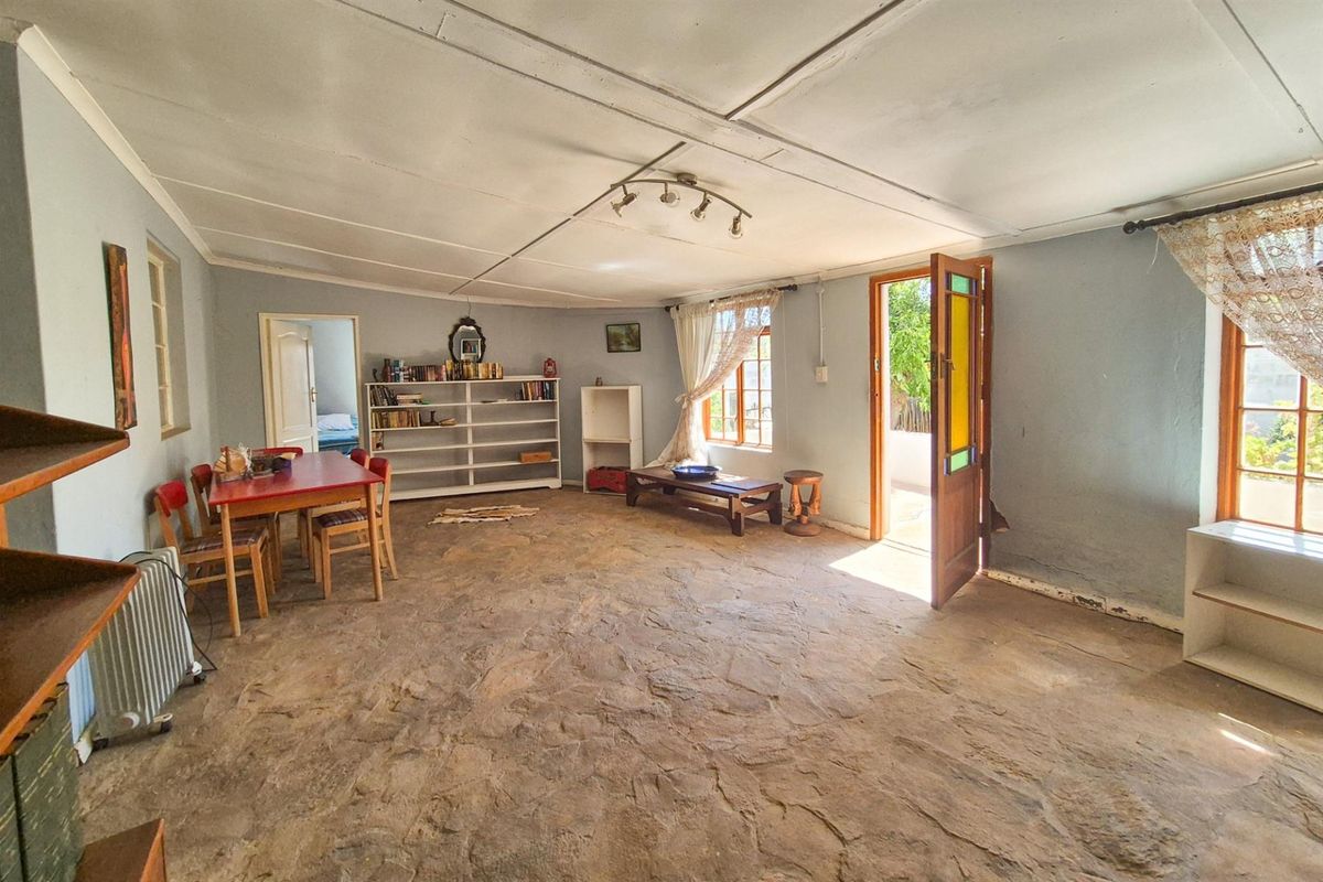 Versatile 4-Bedroom Home with Income-Generating Workshop in Uniondale - Photo 4