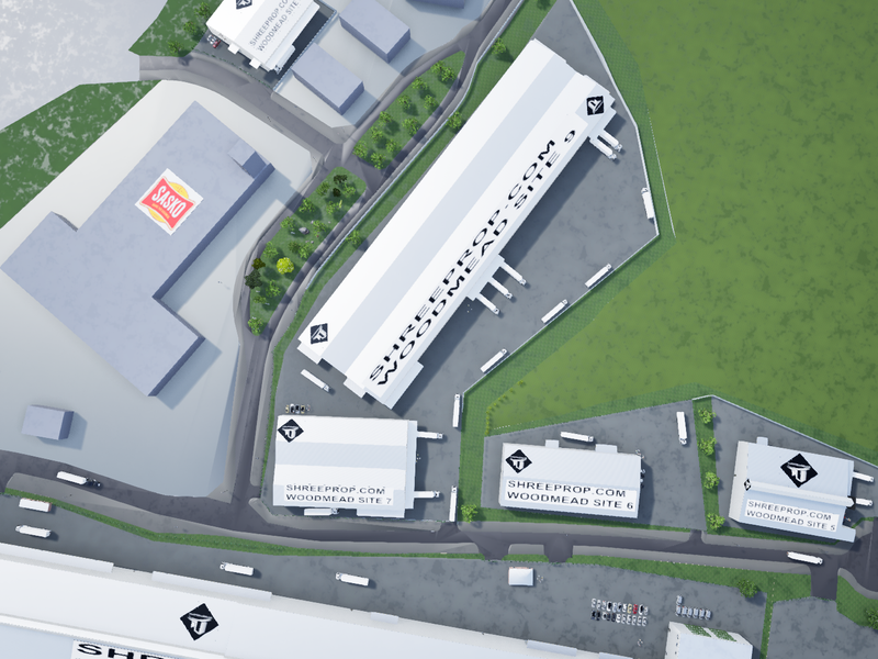 Aerial view of an industrial park featuring multiple warehouse facilities, loading bays, and integrated access roads within a landscaped site.