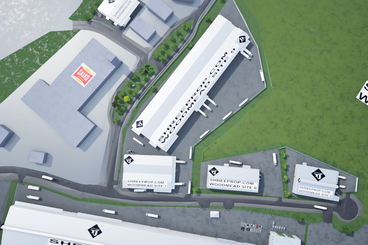 Aerial view of an industrial park featuring multiple warehouse facilities, loading bays, and integrated access roads within a landscaped site.