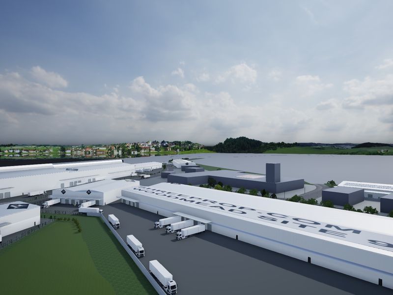 Aerial view of a large-scale industrial warehouse complex featuring extensive loading dock facilities and paved yard space.