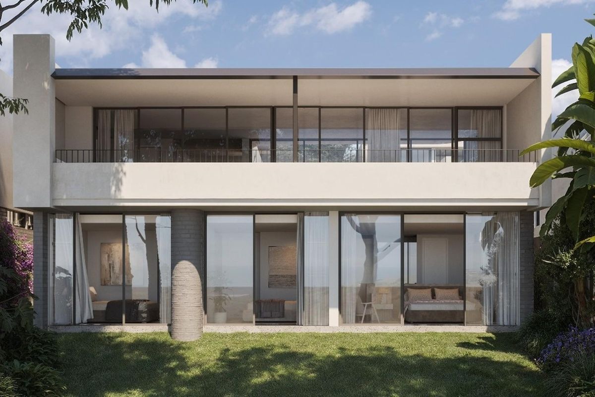 A modern two-story residential exterior featuring large glass sliding doors, a spacious upper balcony, and a well-maintained garden area.