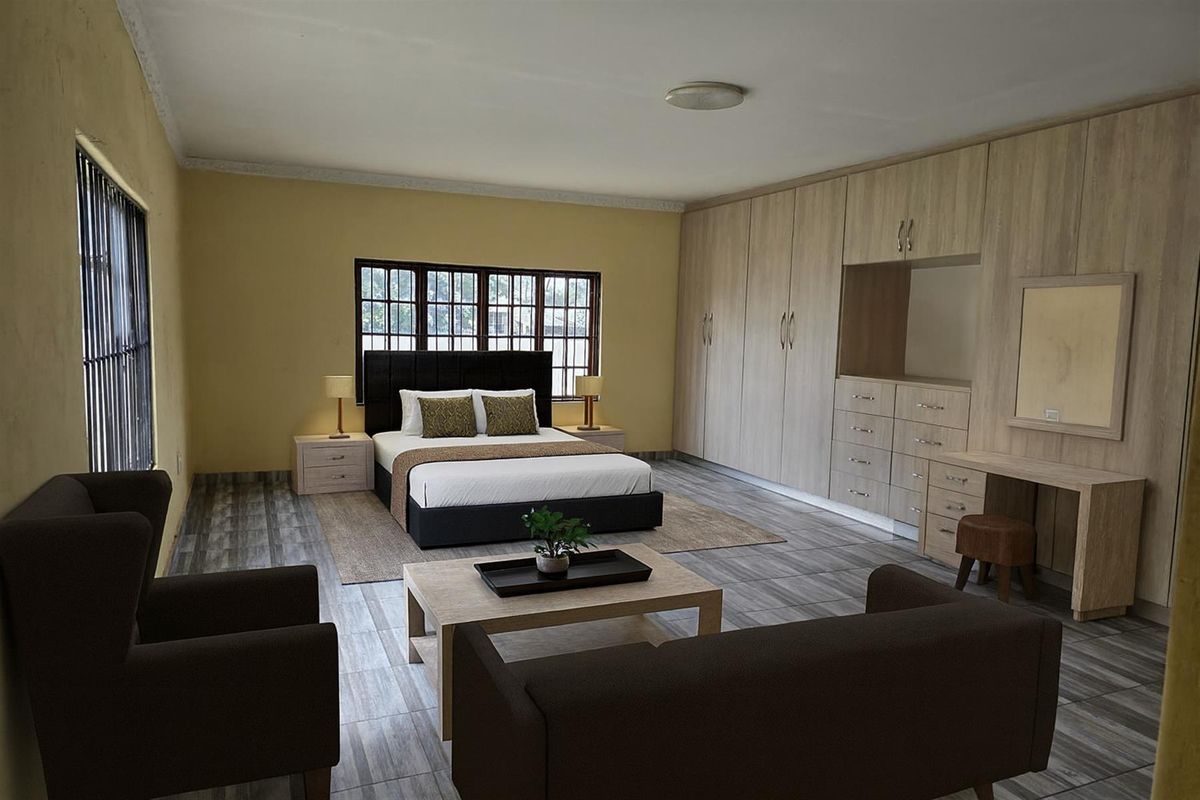 Spacious bedroom featuring extensive built-in light wood cabinetry, tiled flooring, and large windows with security bars.