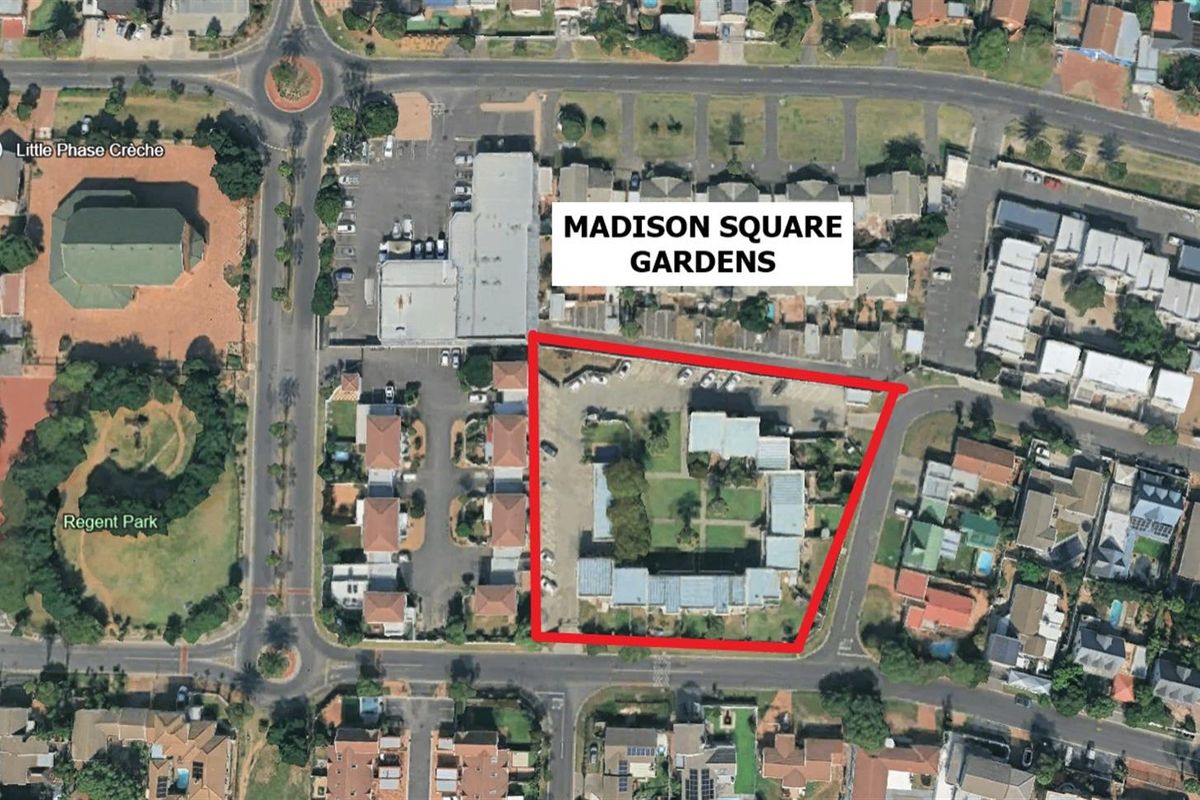 Aerial view of the Madison Square Gardens apartment complex, highlighting the property boundaries and surrounding neighborhood infrastructure.