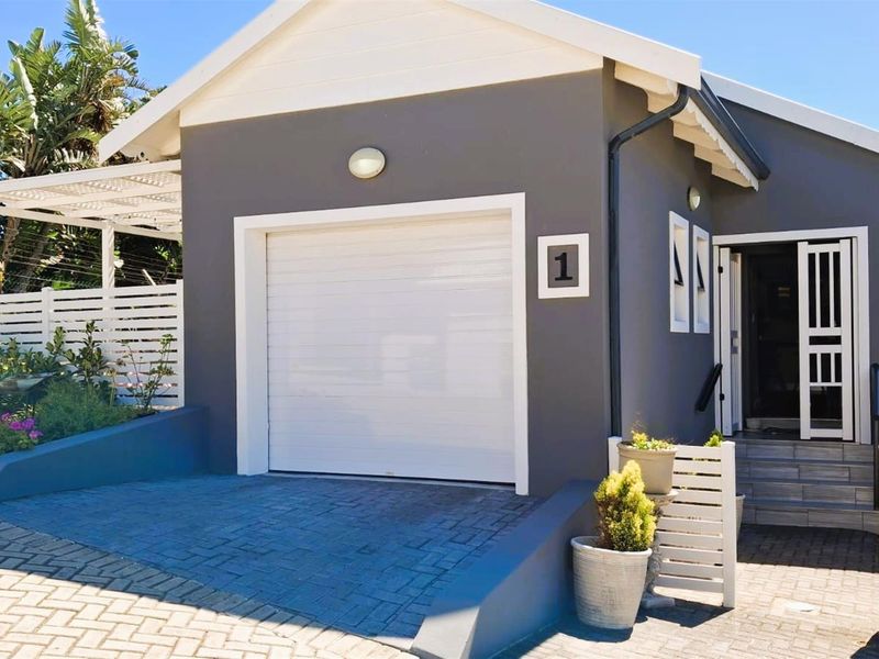 Modern 3-Bedroom Home with Indoor Braai plus Canal Access | Move-In Ready in Marina Martinique - Photo 2