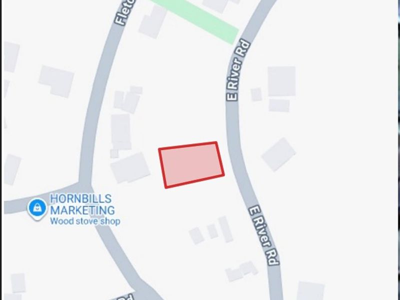 A map view highlighting the location of the vacant residential land parcel situated near E River Road.