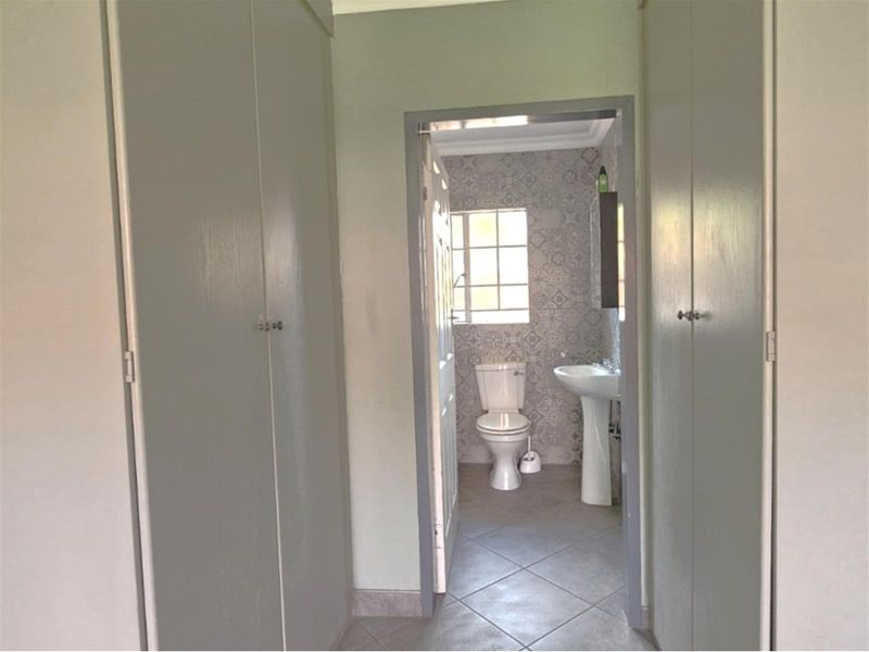 For sale R1 445 000.  An amazing 2 bedroom, 2 bathroom, double garage, patio with build in braai - Photo 10