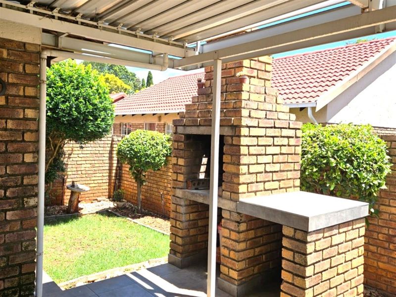 For sale R1 445 000.  An amazing 2 bedroom, 2 bathroom, double garage, patio with build in braai - Photo 5
