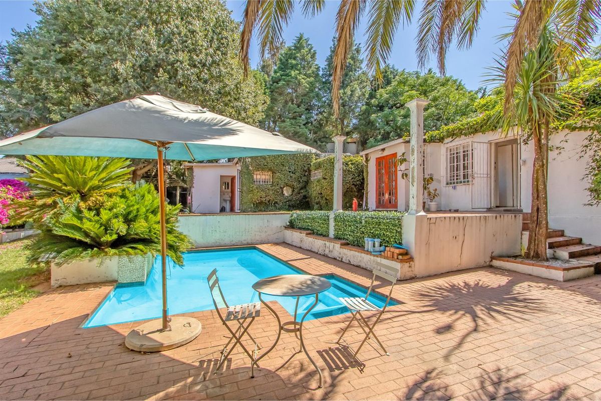 Multi-dwelling property with three dwellings, pool, games room and generator set within mature trees - Photo 3