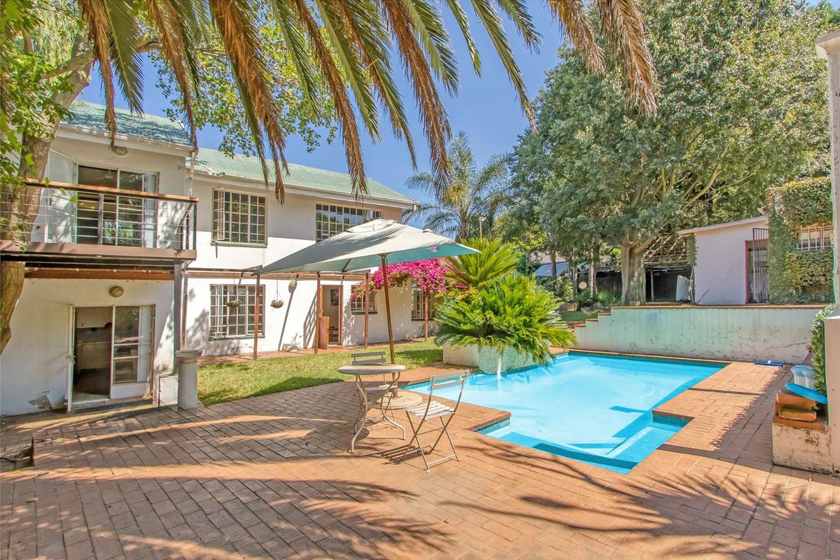 Multi-dwelling property with three dwellings, pool, games room and generator set within mature trees - Photo 2