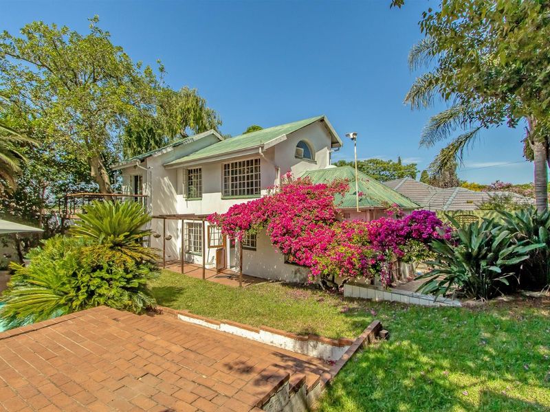 Multi-dwelling property with multiple dwellings, pool, games room, generator set within mature trees - Photo 1