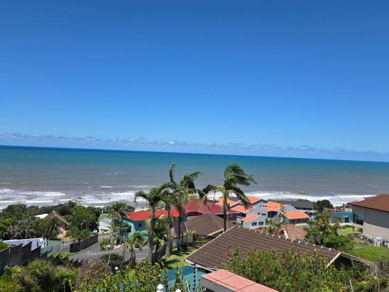 Elevated coastal view overlooking the surrounding residential neighborhood and the ocean horizon.
