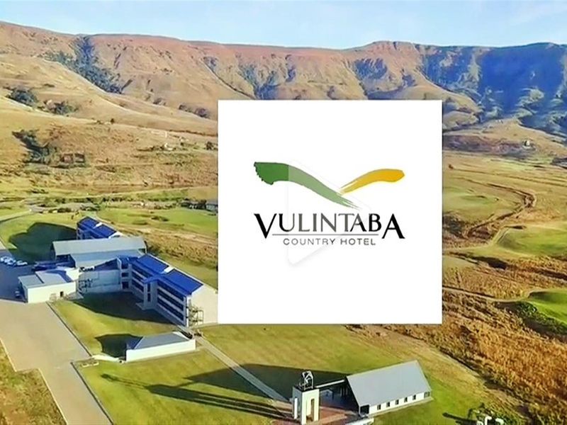 Aerial view of the Vulintaba Country Hotel property, showcasing the expansive landscape, surrounding mountains, and the hotel building complex.