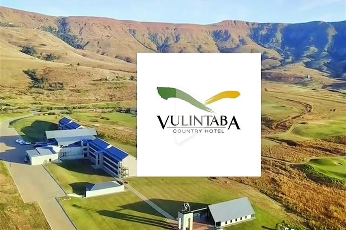 Aerial view of the Vulintaba Country Hotel property, showcasing the expansive landscape, surrounding mountains, and the hotel building complex.