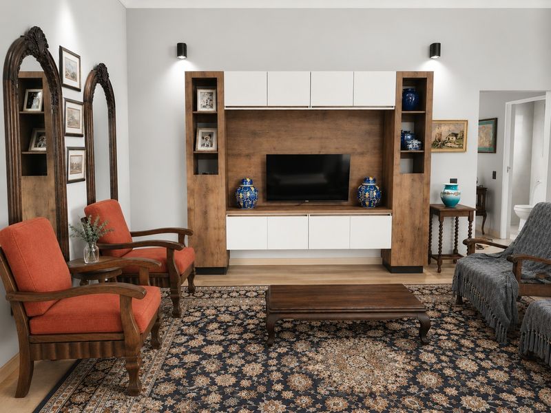 A well-maintained living room featuring a large, modern built-in media unit with integrated cabinetry and stylish wall-mounted accent lighting.
