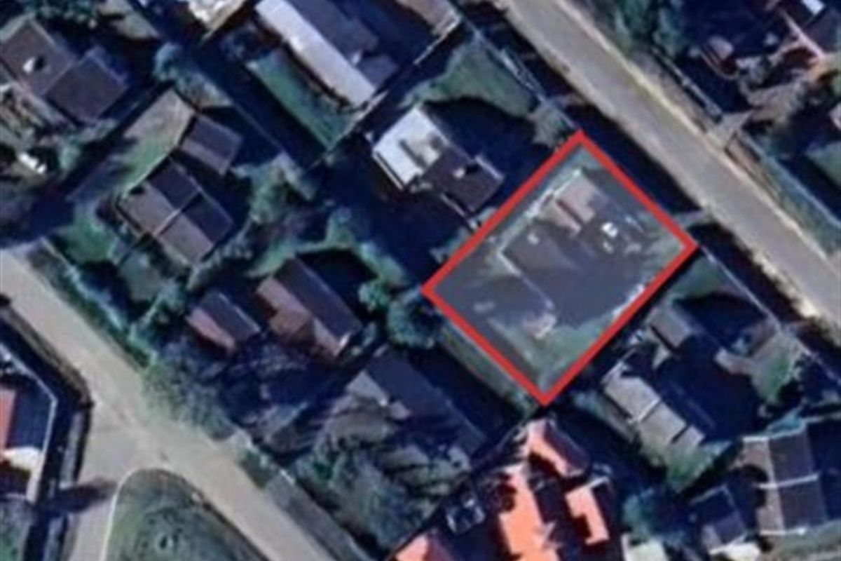 An aerial view of the property highlighting its position and boundary within the residential neighborhood.