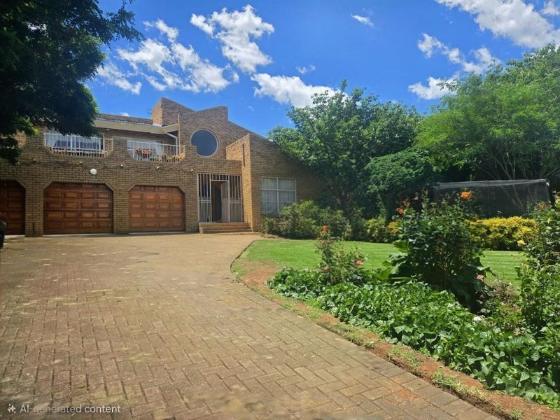 Front view of a double-story brick house featuring a paved driveway, double garage, and a well-maintained garden.