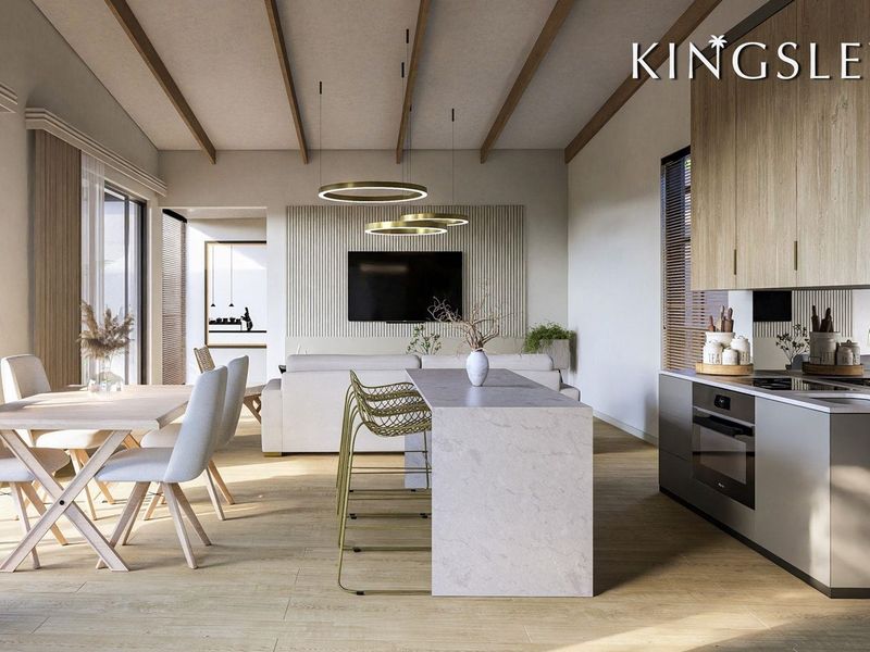Modern open-plan living area featuring a sleek kitchen with stone island, timber cabinetry, exposed ceiling beams, and a contemporary slatted feature wall.