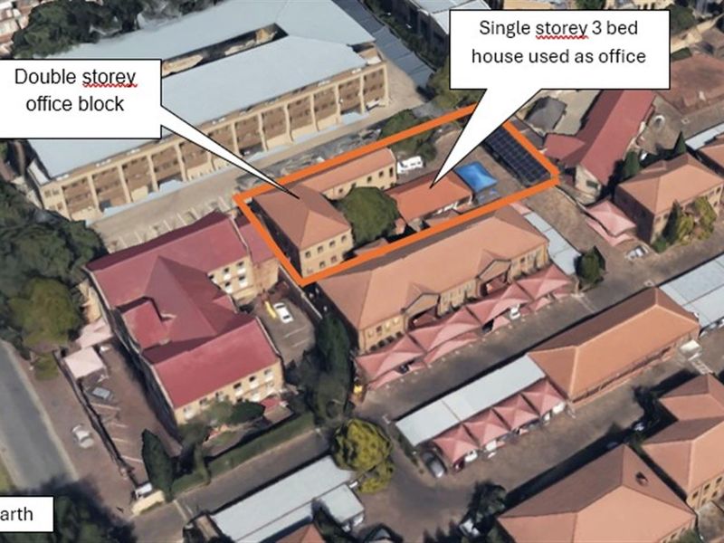 Aerial view of the office property complex, featuring a double-storey office block and a single-storey building currently utilized as office space.