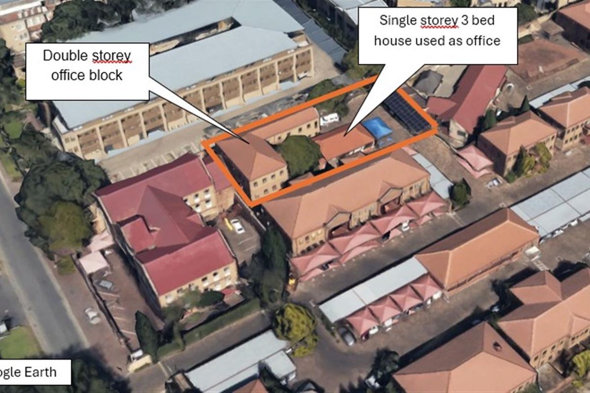 Aerial view of the office property complex, featuring a double-storey office block and a single-storey building currently utilized as office space.