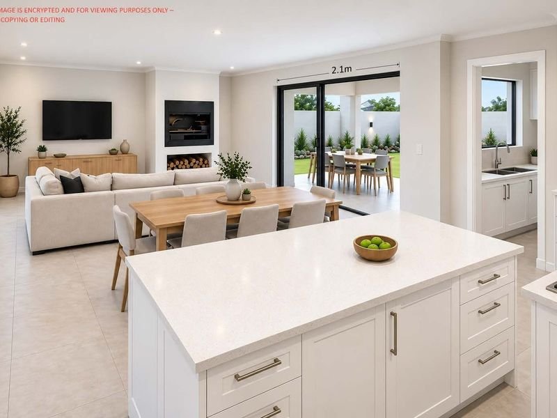 Spacious open-plan living area featuring a modern kitchen with stone island, fireplace, and seamless flow to the outdoor patio through sliding glass doors.