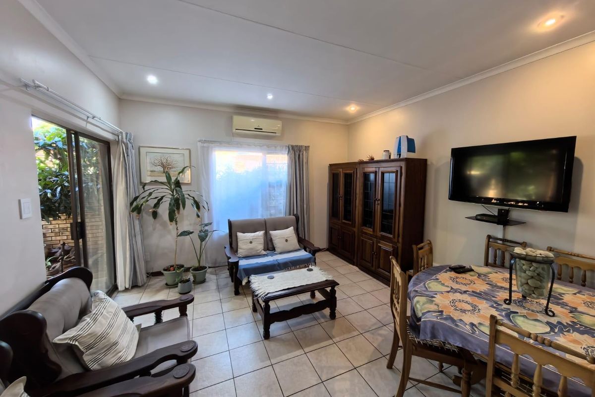 Modern Ease and Suburban Serenity: Your FULL TITLE Secure "Lock-Up-and-Go" Sanctuary - Photo 2