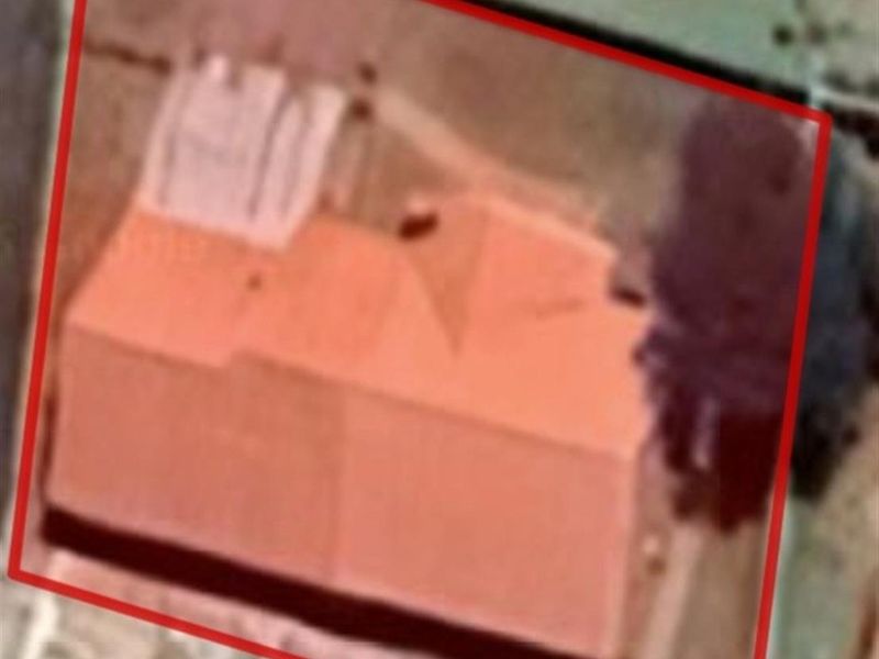 An aerial view of the property showing the roof structure and surrounding plot area.