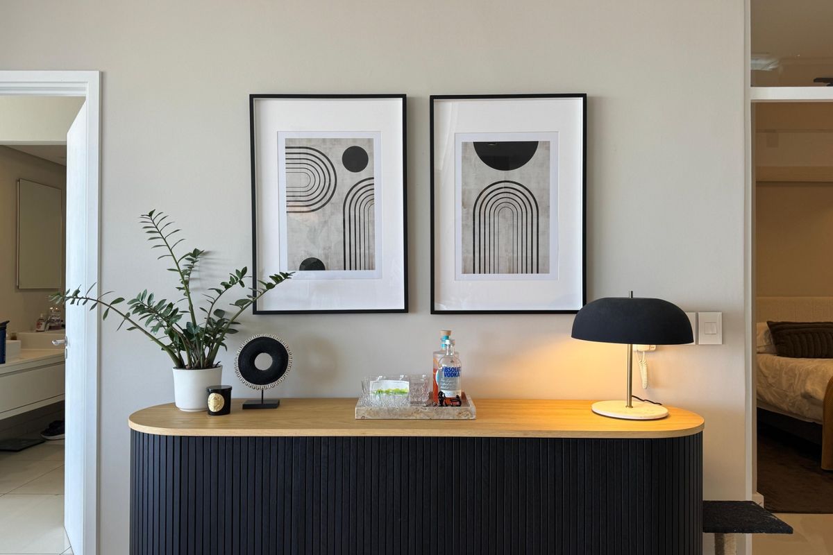A well-maintained living area featuring neutral wall tones and modern architectural details, providing a clean and inviting space.