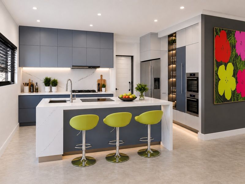 Modern kitchen featuring a large island with stone countertops, integrated appliances, sleek cabinetry, and recessed lighting in a contemporary open-plan layout.