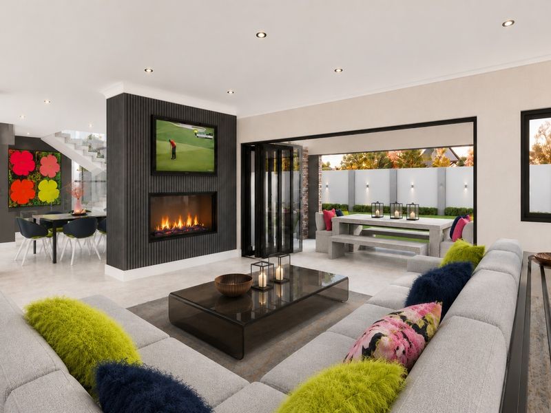 Modern open-plan living area featuring a sleek gas fireplace, slatted feature wall, and seamless indoor-outdoor flow through large stacking glass doors to the patio.