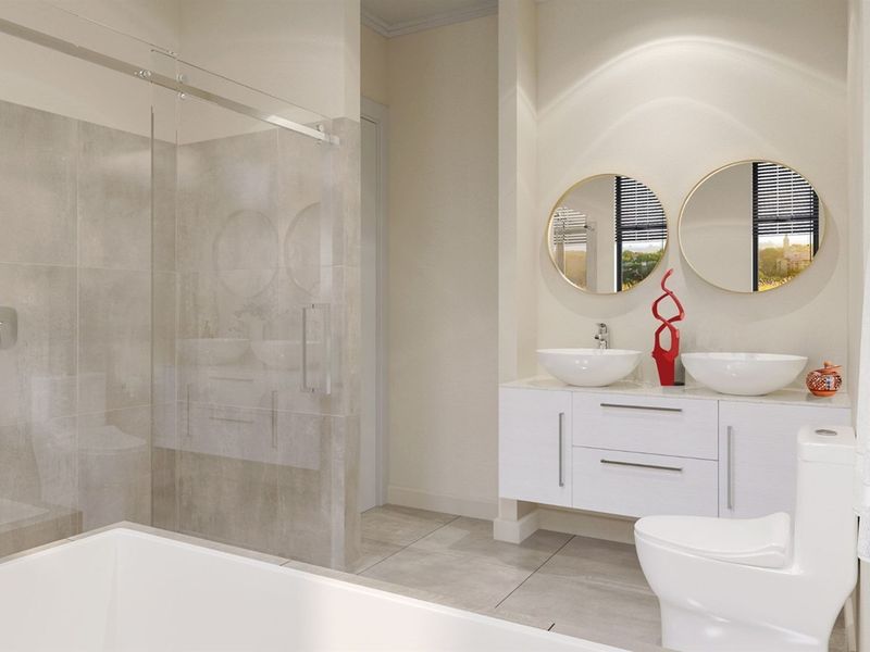 Modern bathroom featuring a double vanity with vessel sinks, a walk-in shower with glass enclosure, and contemporary tiled finishes.