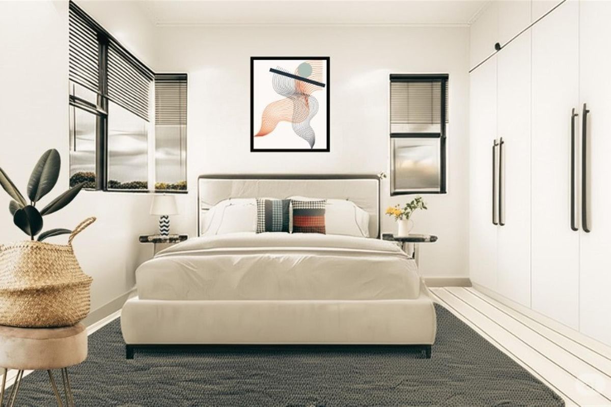 A modern, well-lit bedroom featuring built-in cupboards and venetian blinds, presenting a clean and contemporary aesthetic.