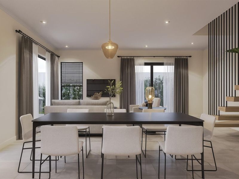 Modern open-plan living and dining area featuring tiled floors, a striking floating staircase with a slatted screen, and abundant natural light through sliding doors.